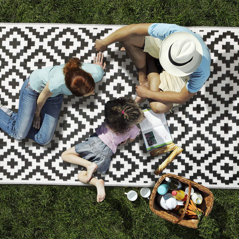 SAND MINE camping rug provides a dry, clean base during outdoor adventures.