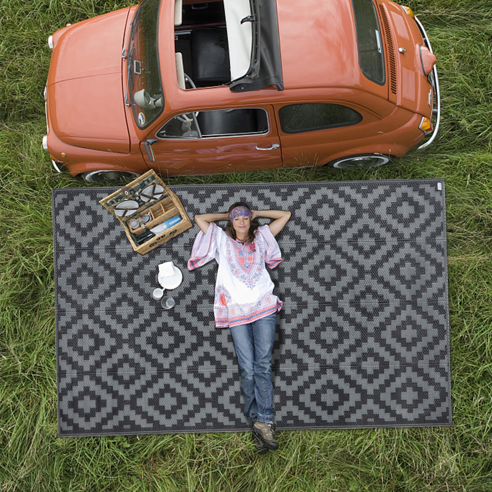 SAND MINE easy-clean outdoor rug rinses clean after outdoor gatherings