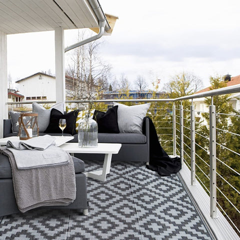 SAND MINE breathable rug that is grass-friendly and deck-safe