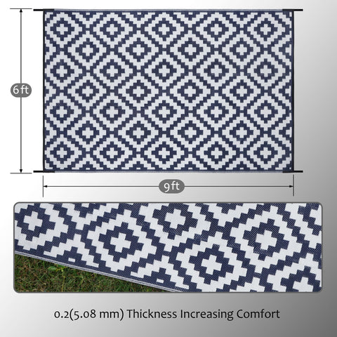 SAND MINE plastic straw rug shown at the beach-ready area for outdoor gatherings.