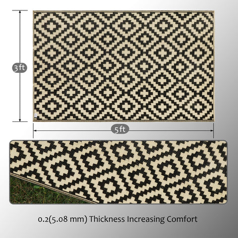 SAND MINE plastic straw rug folded for easy storage after outdoor use