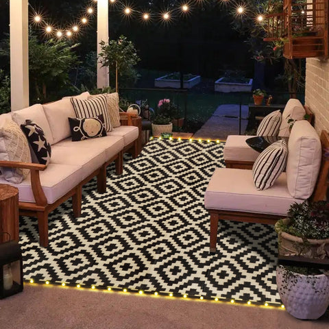 SAND MINE included carrying bag shown with reversible rug outdoors