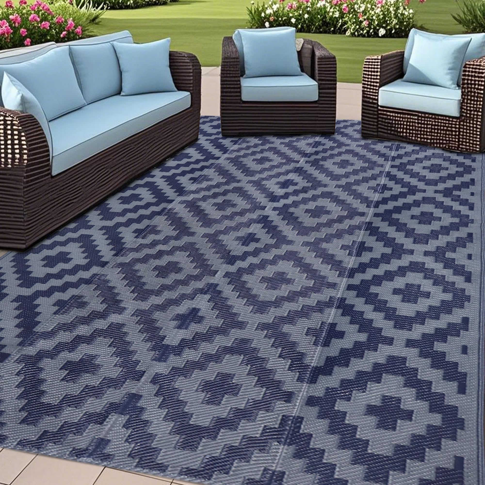SAND MINE Reversible Mats on a blue-grey lattice patio, durable and easy to clean