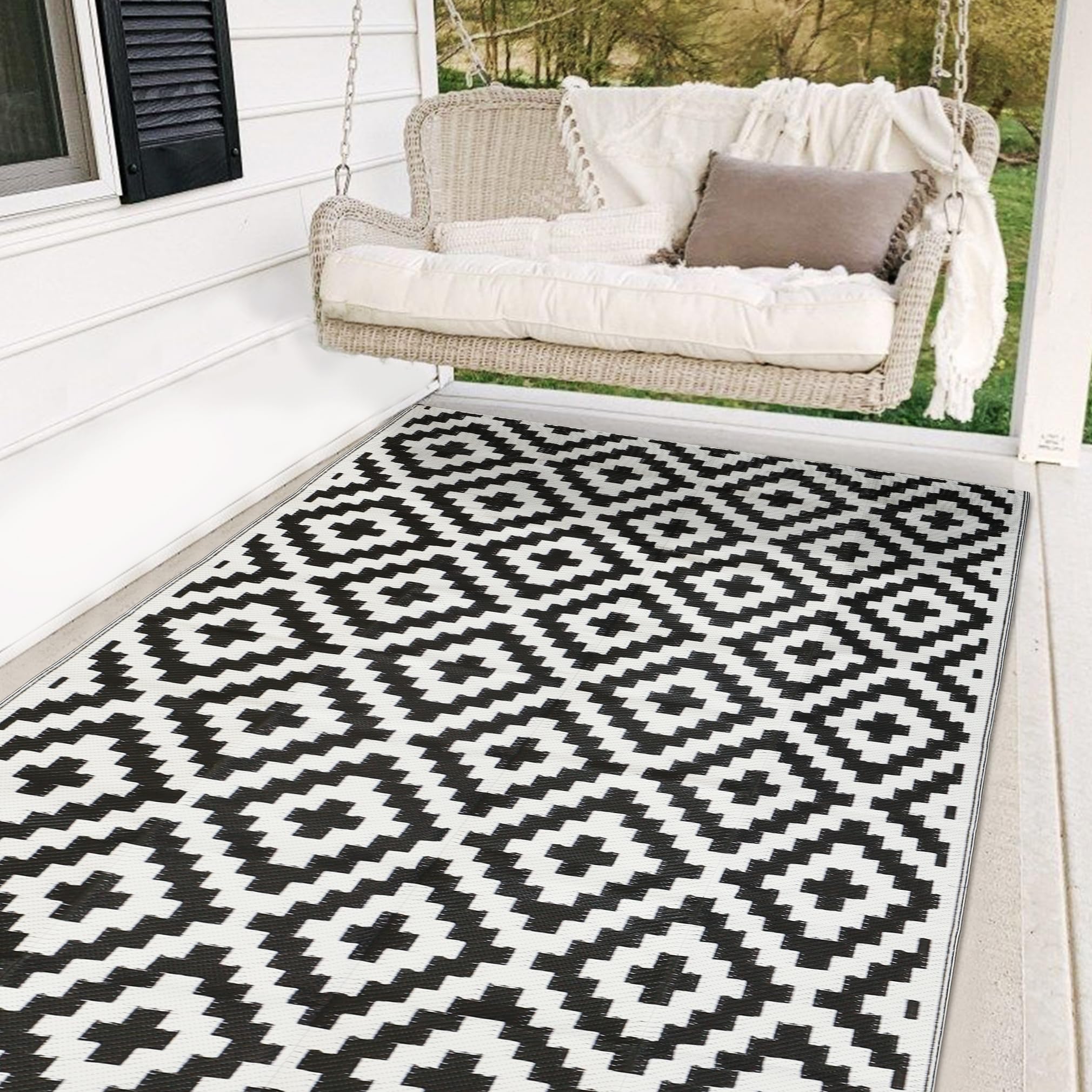 SAND MINE waterproof outdoor rug 5x8 laid on a sunlit patio for clean outdoor living.
