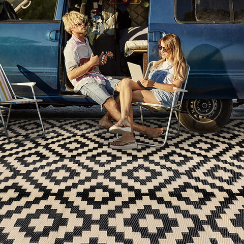 SAND MINE waterproof outdoor rug 9x18 ft on patio, durable and easy to clean.