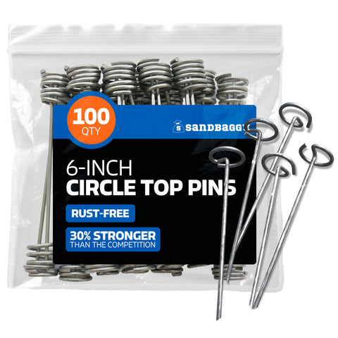 Sandbaggy 6-inch circle-top pin secures landscape fabric firmly in windy conditions.