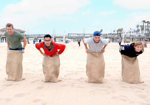 Sandbaggy 24x40 burlap sacks opened, ideal for large sack races.