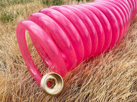 SANFU EVA pink translucent hose used outdoors on deck or boat.