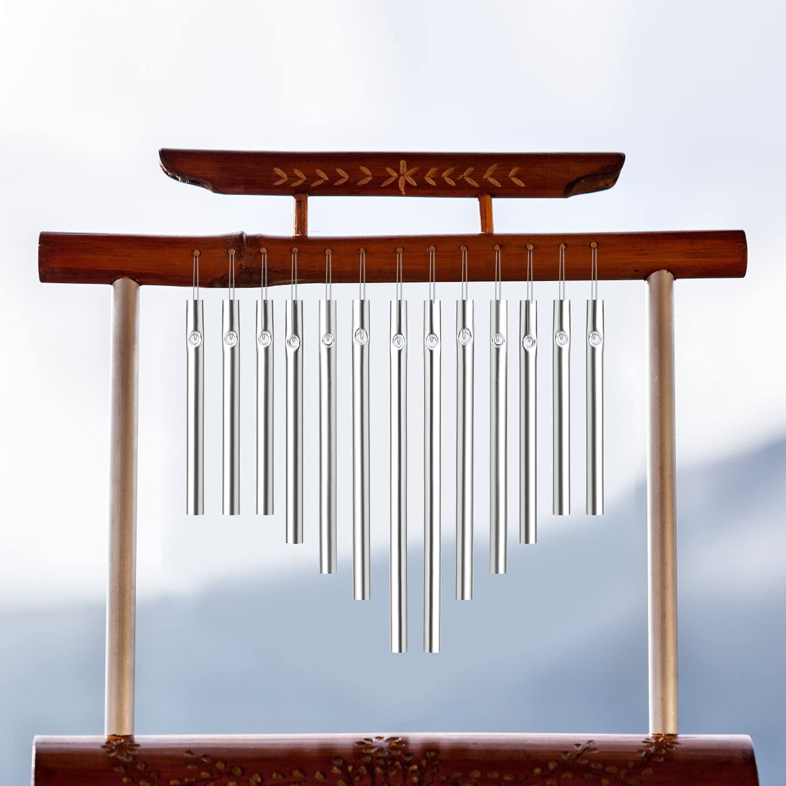 Sansheng wind chime tubes hanging on a porch ready to enjoy a breeze.