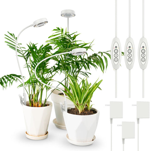 SANSI Grow Lights clipped to pot with flexible arm for focused plant growth.