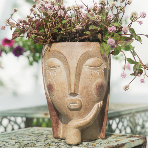 Saysmile head planter with thinking-face design enhances indoor plant displays.