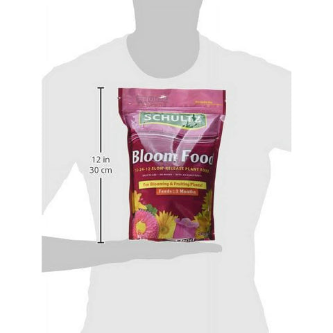 Schultz SPF48270 bloom fertilizer in garden with vibrant blooms