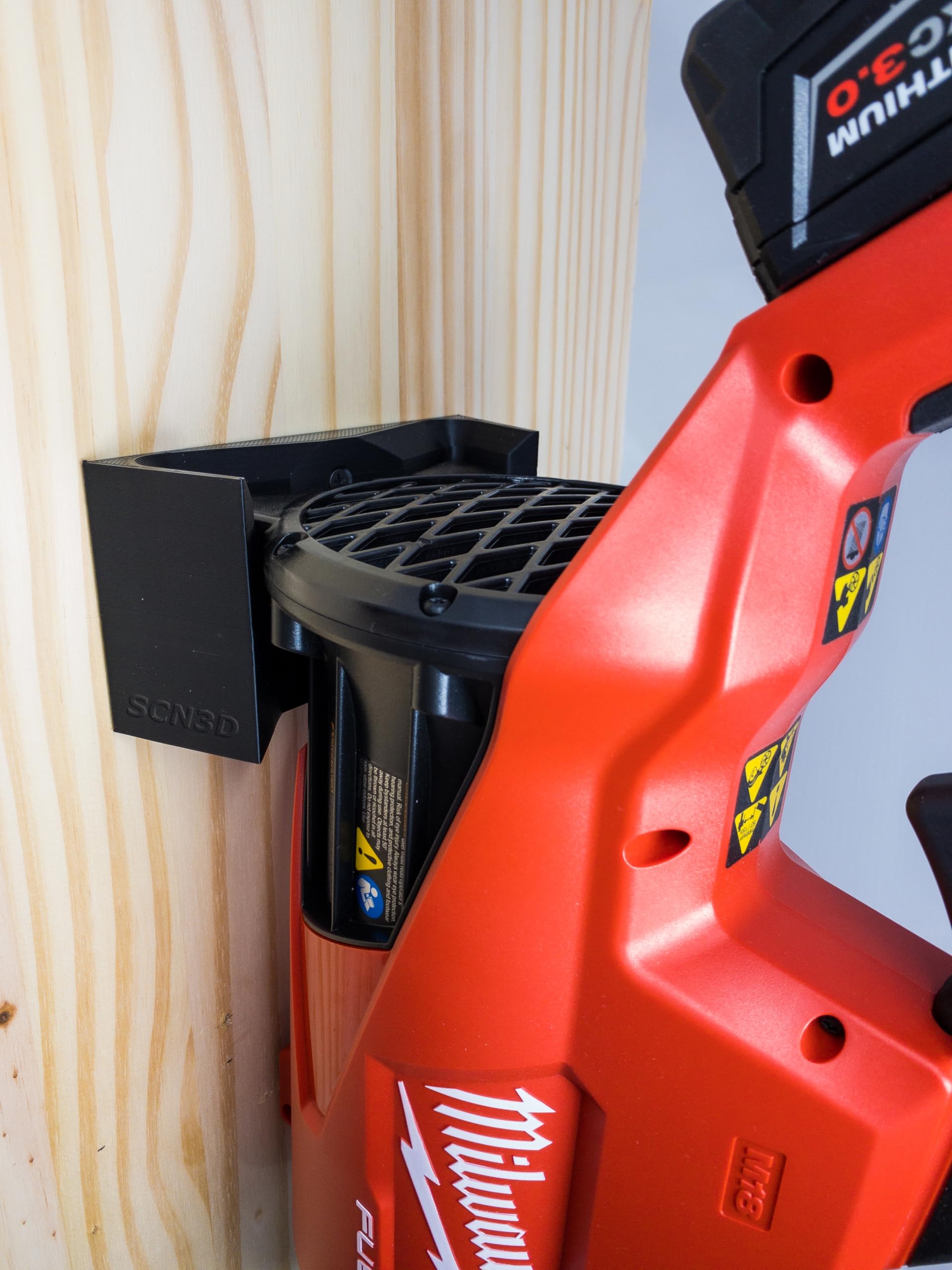 SCN3D Milwaukee M18 Fuel wall mount installed on wall with blower secured.
