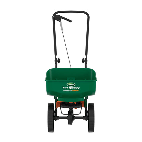 Scotts EdgeGuard Mini spreader with curved hopper optimizes even lawn product coverage.
