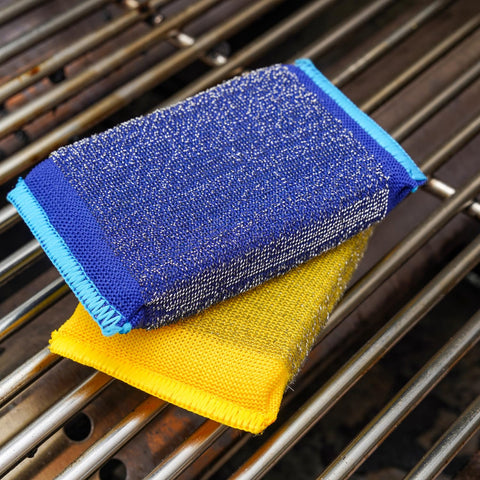 BBQ Daddy built-in grill scraper clears char and debris efficiently.