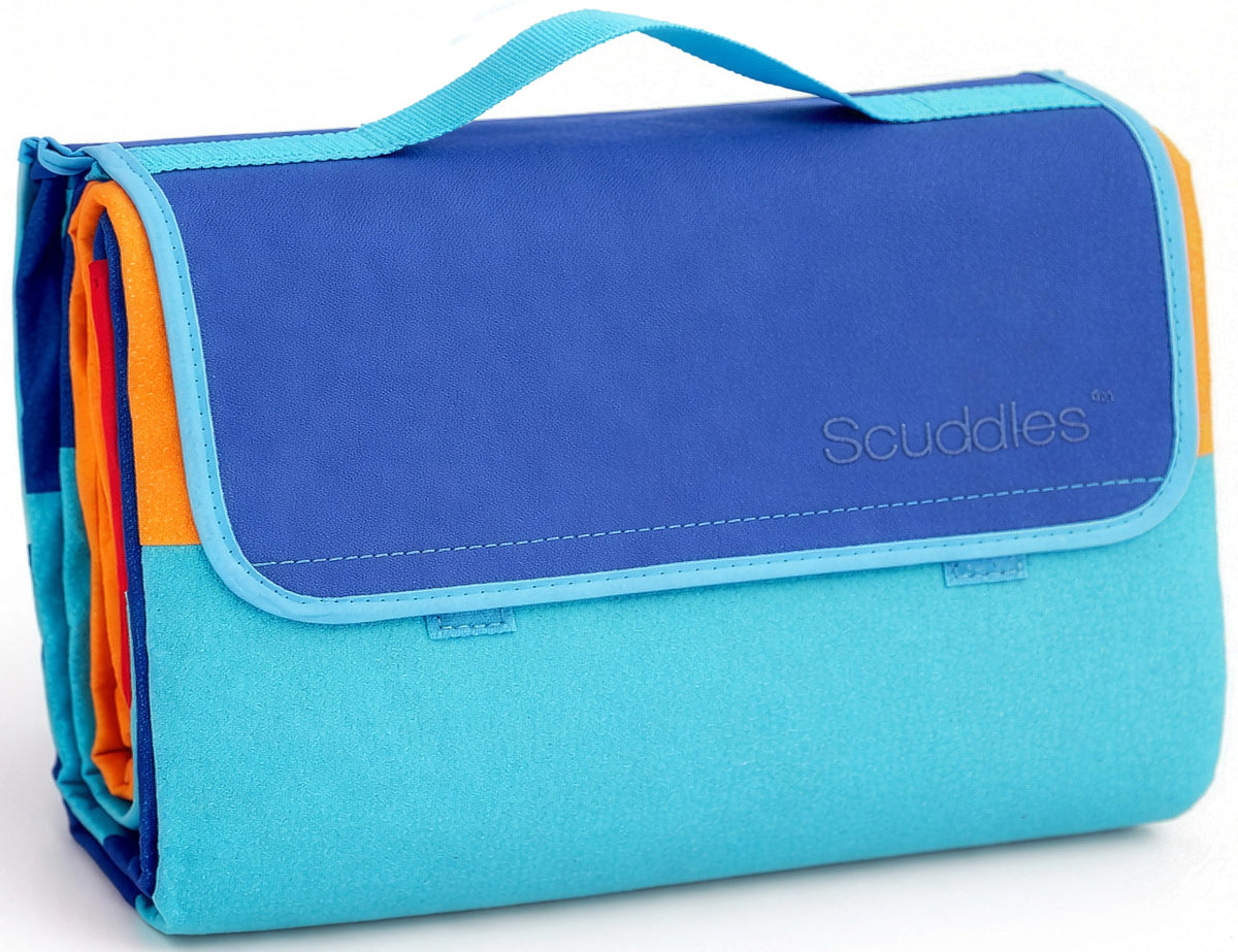 Scuddles extra large picnic blanket on grass with waterproof backing for dry comfort.