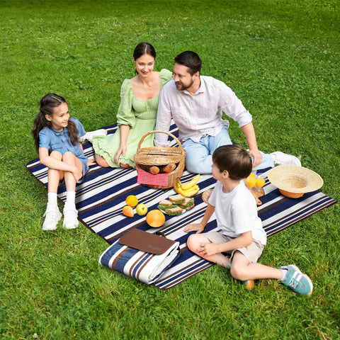 Scuddles blanket opened on grass for a family picnic and comfort