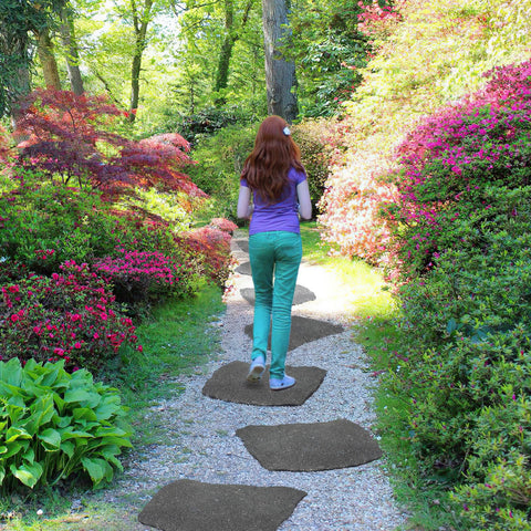 Sekcen natural grey pathway stones blend with greenery for subtle routes.