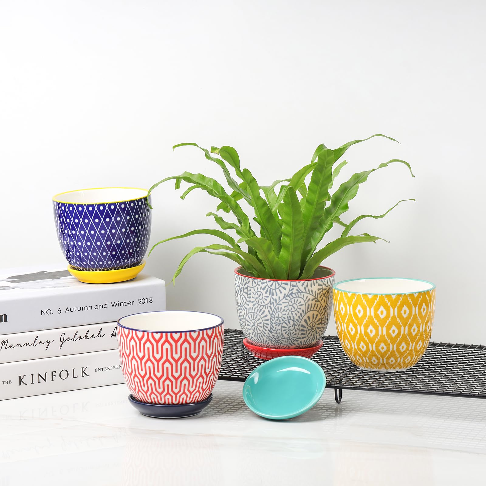 Selamica set of four plant pots for windowsill display.