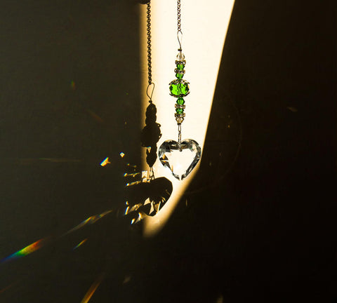 SevenFish heart suncatcher with green chain enhances window sparkle