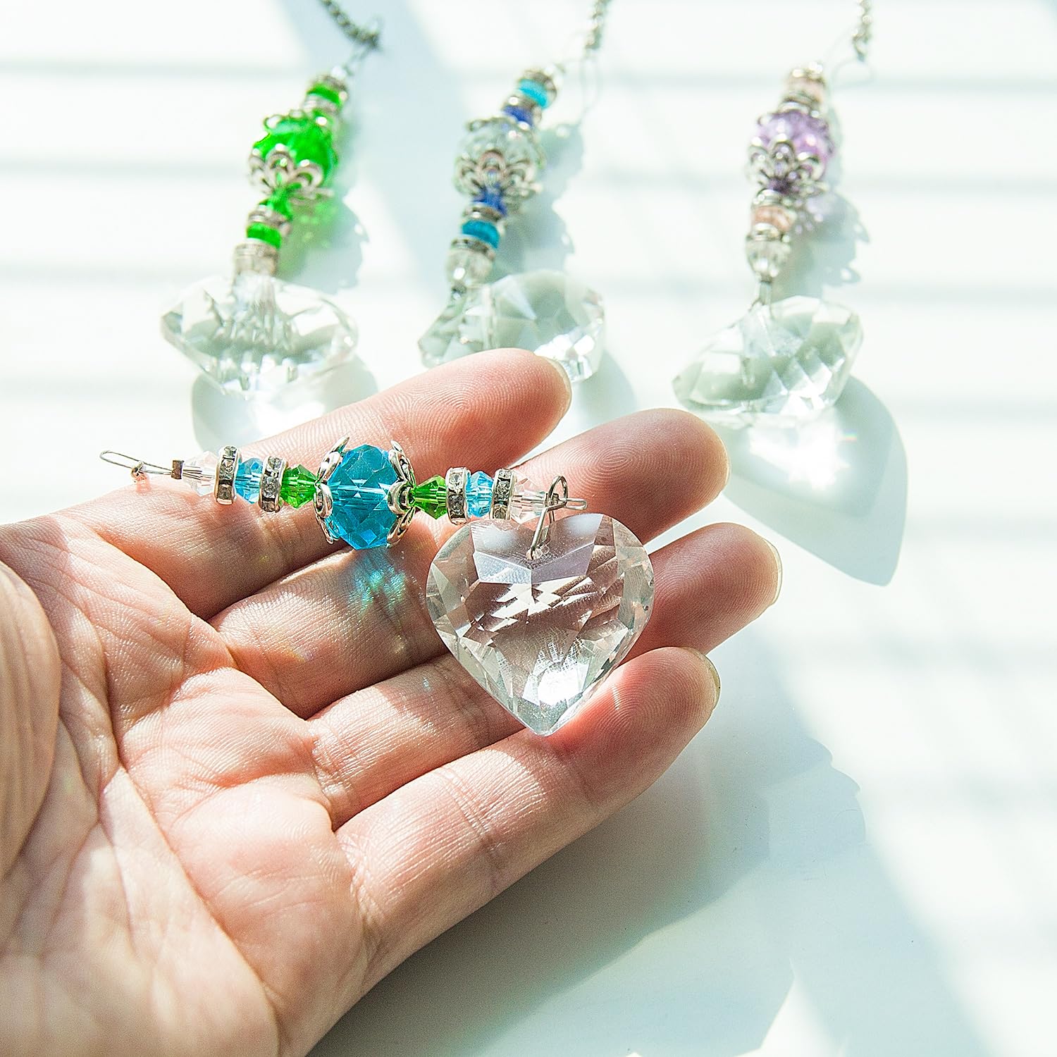 SevenFish heart suncatcher with purple chain adds colorful light accents