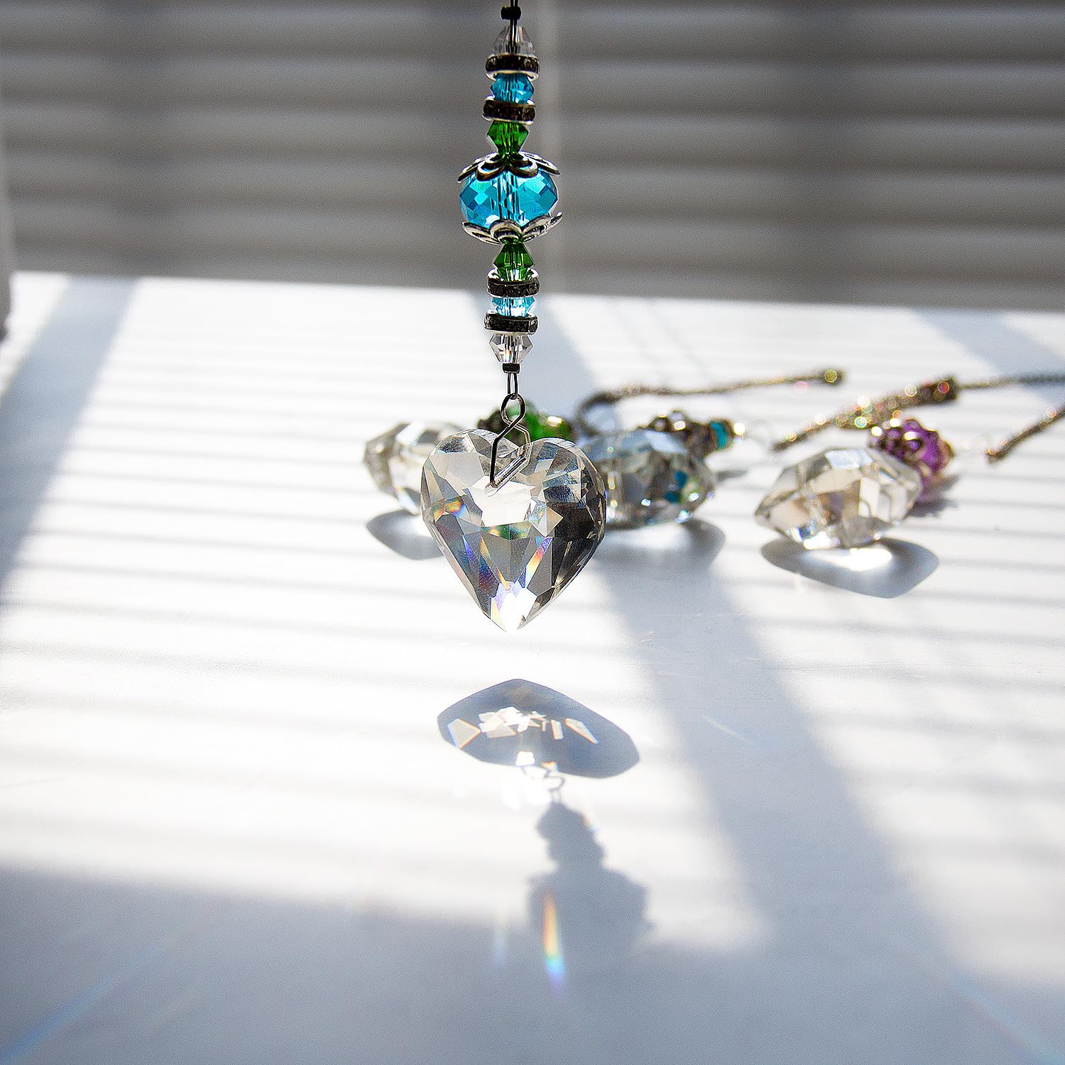 SevenFish window-view crystal suncatcher casts bright rainbow reflections