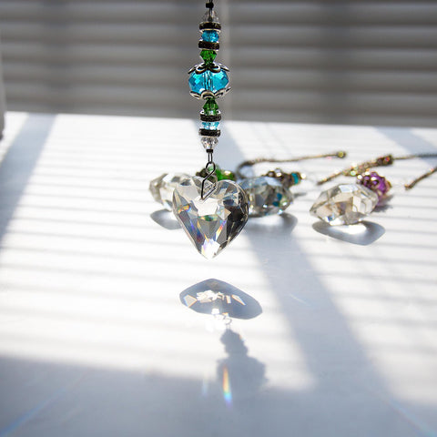 SevenFish window-view crystal suncatcher casts bright rainbow reflections