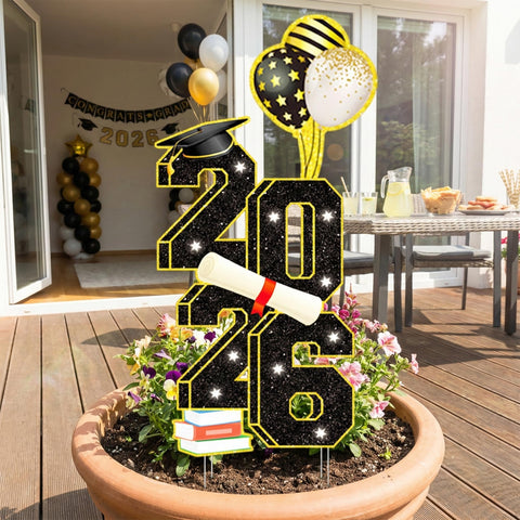 Sewrung graduation yard sign in sunlight brightens outdoor event spaces.