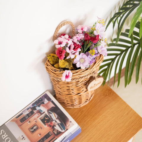 SHCMSADO basket holding fresh flowers as a delicate wall feature.