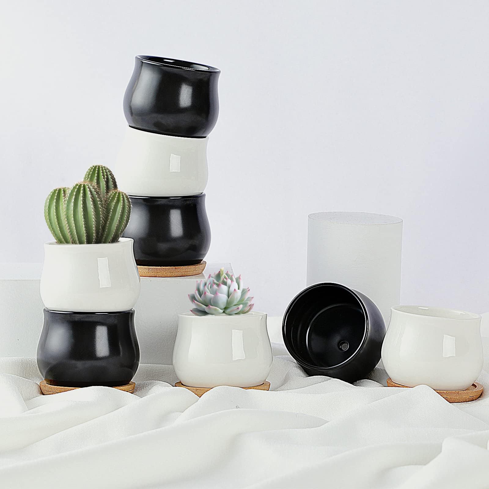 SHECIPIN set of two durable ceramic planters for small plants.