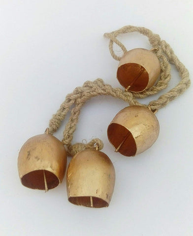 Siddhivinayak Overseas four-cow-bell decor creates peaceful soundscape.
