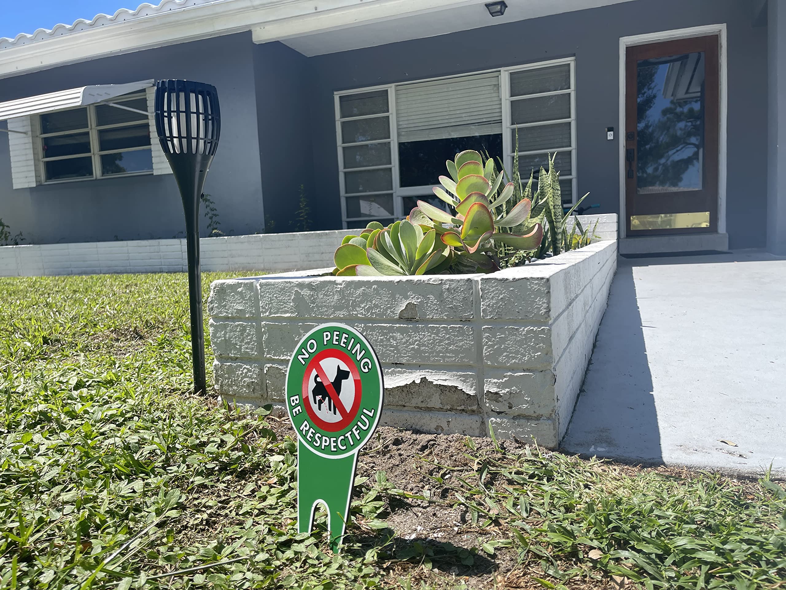 Signs Authority no-poop-dog-sign-yard promotes courteous behavior in shared spaces