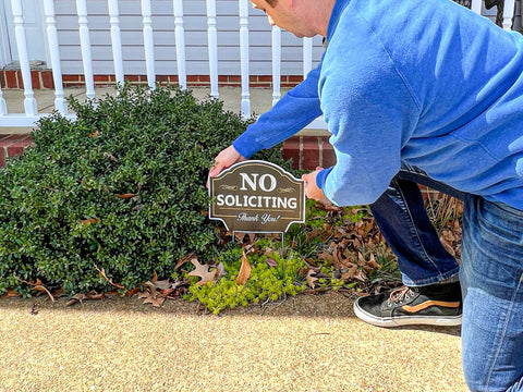 Signs Authority no soliciting sign placed along yard or walkway