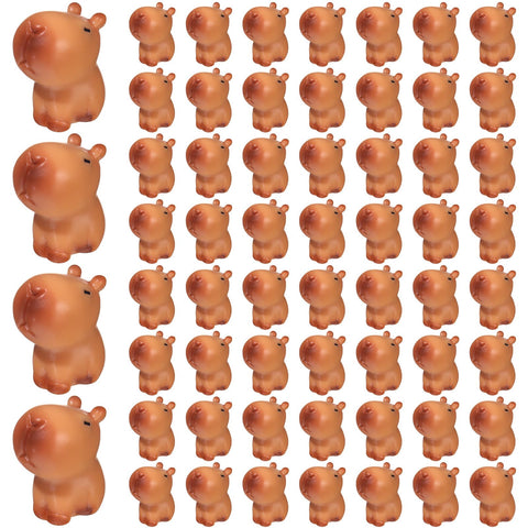 Simgoing capybara figurines on a desk create a whimsical focal point.
