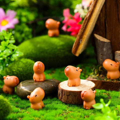 Simgoing capybara figurines enhance garden decor with a tiny charming presence.
