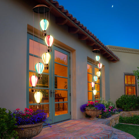 Singingarden waterproof wind chime remains luminous after rain for continued ambiance.