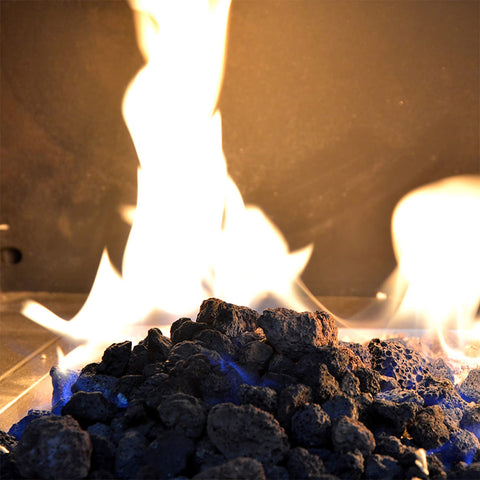 Base layer under glass for even distribution around flames