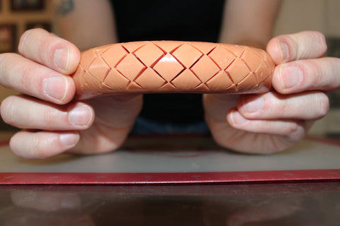 SLOTDOG diamond slots improve toppings adhesion during cooking.