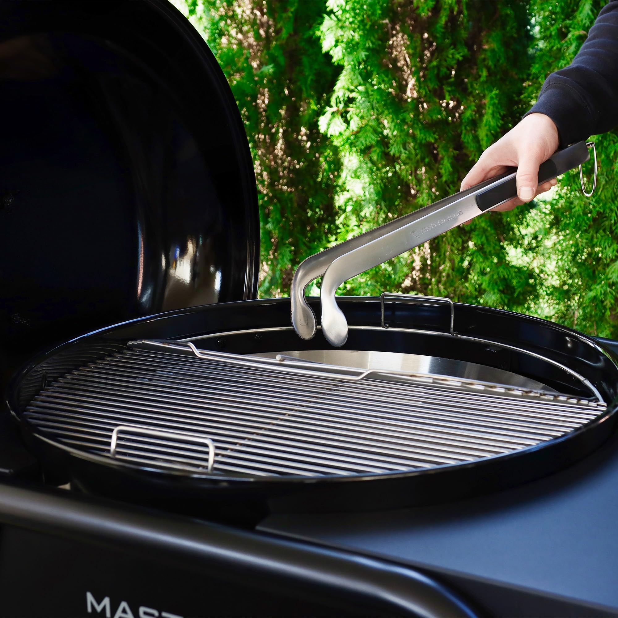 Slow 'N Sear Charcoal Cherry Picker with long handle for safer grilling