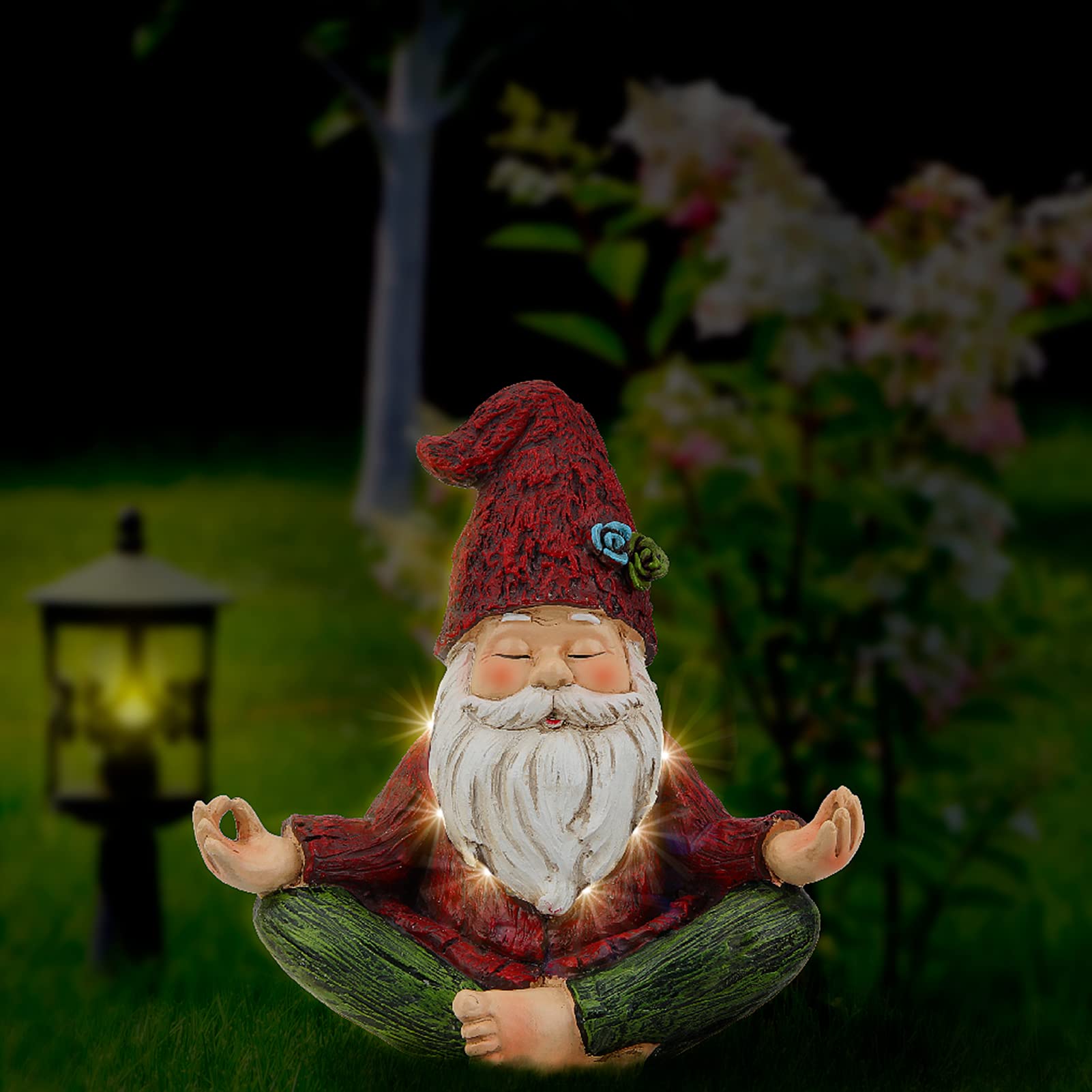 Smadeer knome in yoga pose figurine visible on a lawn