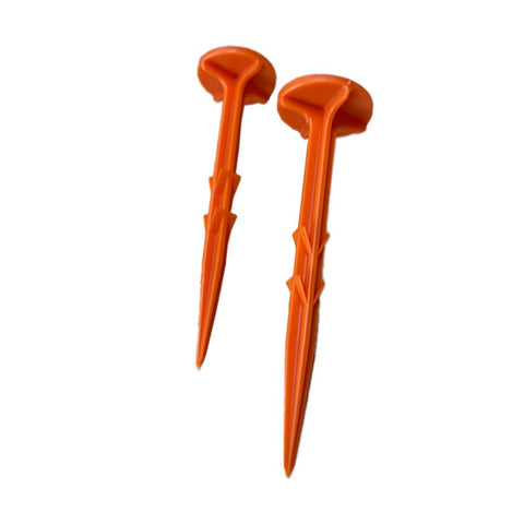 Smart Spring low-profile survey stake orange, flush with ground for easy mowing