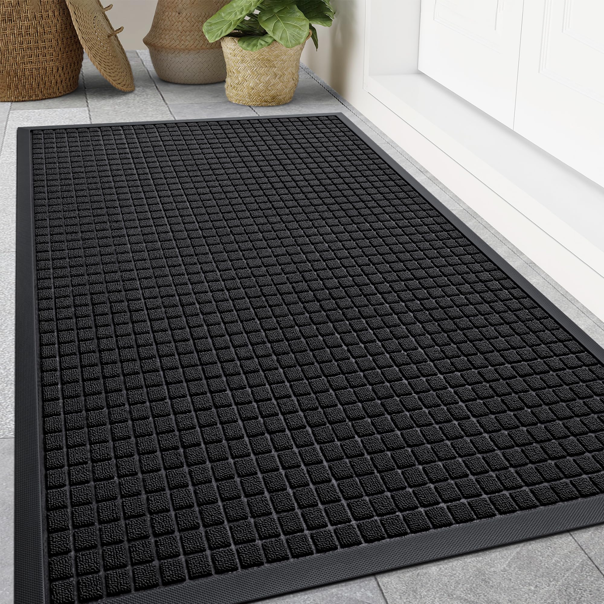 Smiry front door mat outside entrance with woven surface trapping dirt and moisture.