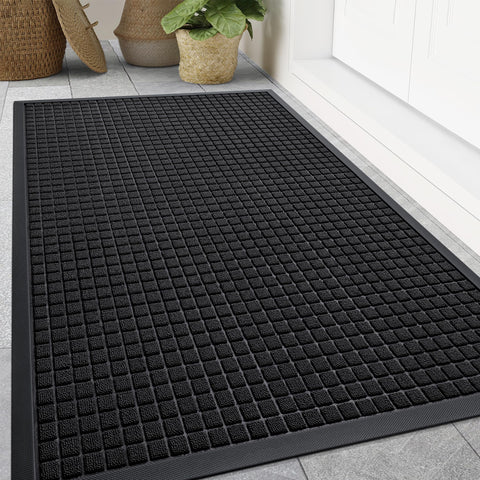 Smiry front door mat outside entrance with woven surface trapping dirt and moisture.