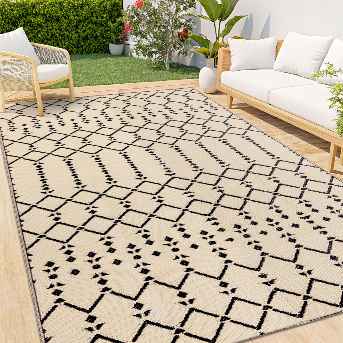 Smiry 6x9 outdoor rug with geometric pattern enhances the patio space.
