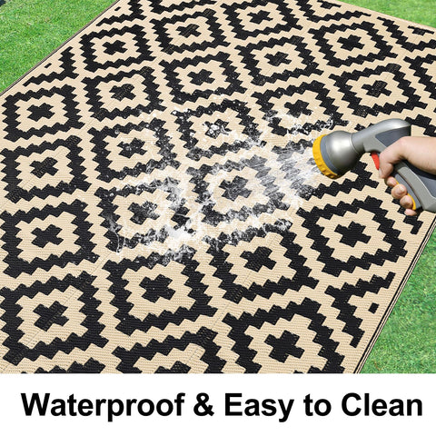 Smiry rug shown reversible with double-sided colors for versatile outdoor styling.