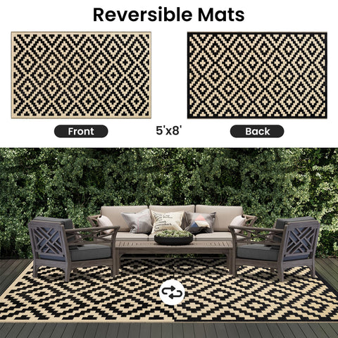 Smiry waterproof outdoor rug being quickly cleaned with hose, ideal for outdoor messes.