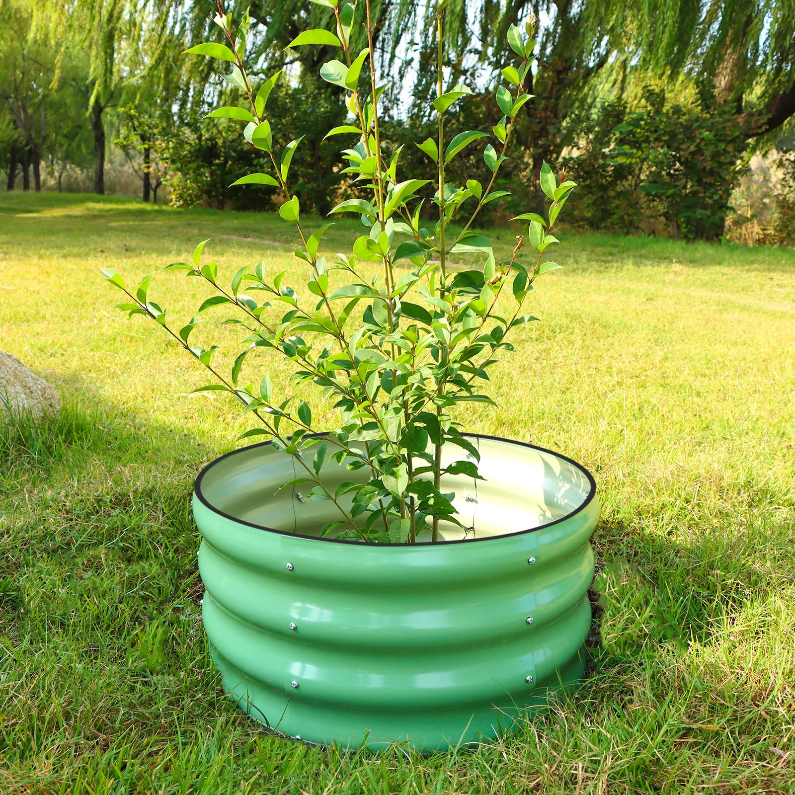 SnugNiture metal planter box suitable for vegetables and flowers in a yard.