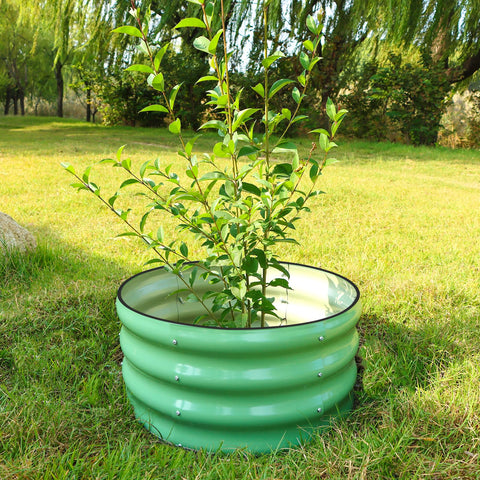 SnugNiture metal planter box suitable for vegetables and flowers in a yard.