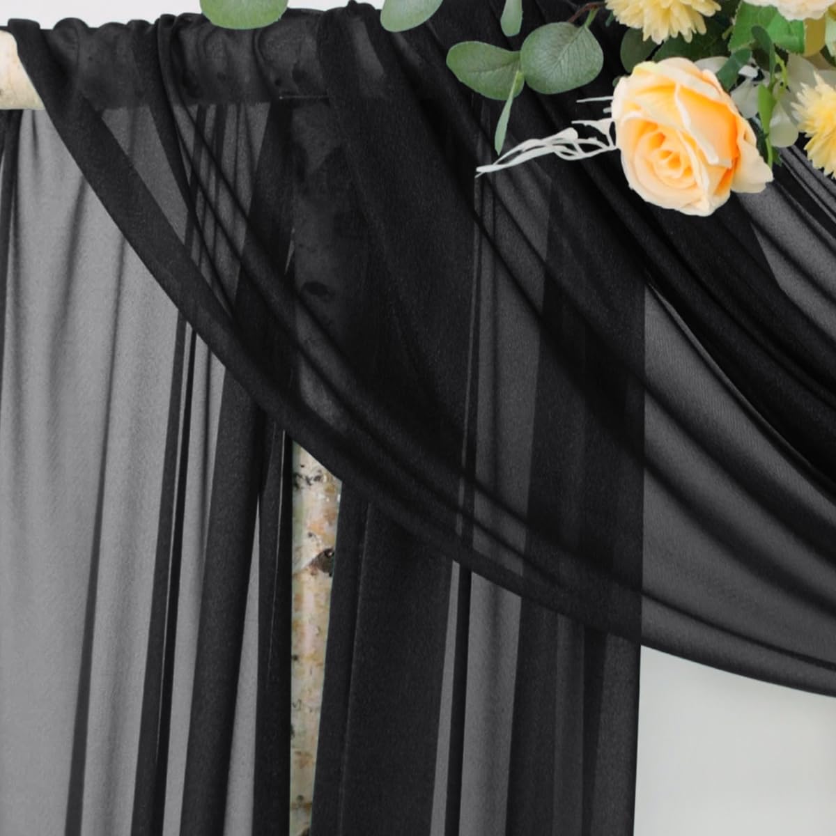Socomi Black Sheer Floor Drape creates romantic flow for photos.