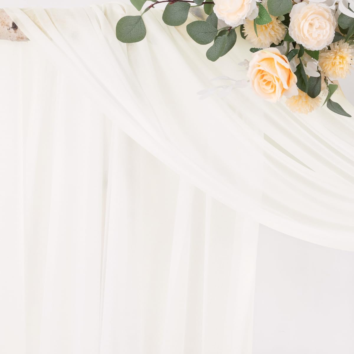 Socomi Ivory White draping over a canopy arch, soft folds create romantic ambiance.